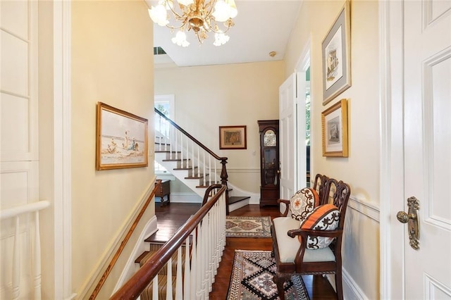 interior space featuring dark hardwood / wood-style flooring and a notable chandelier