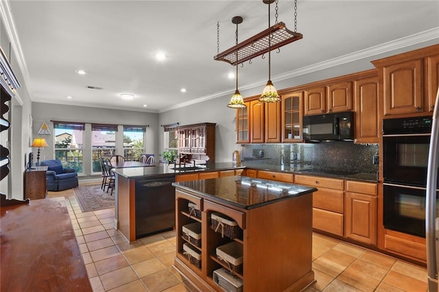 kitchen with decorative light fixtures, black appliances, a kitchen island, and light tile patterned floors