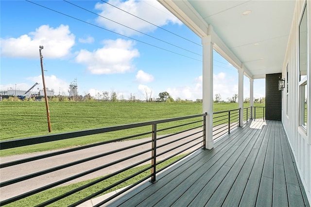 wooden terrace with a rural view