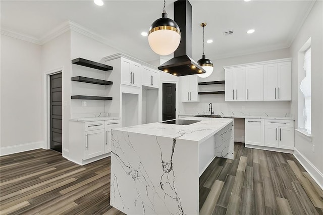 kitchen with a center island, sink, hanging light fixtures, white cabinetry, and island exhaust hood