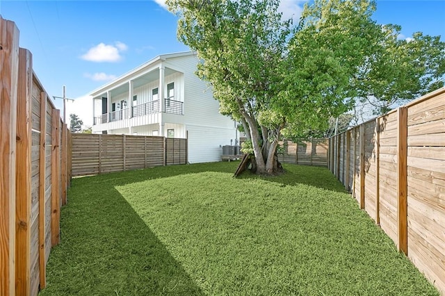 view of yard with central AC unit