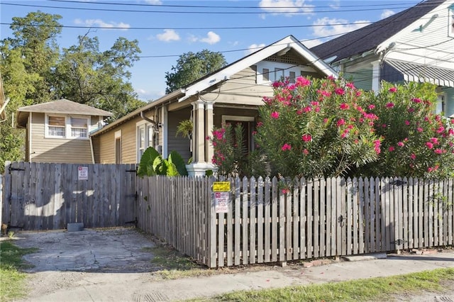 bungalow-style house with a fenced front yard