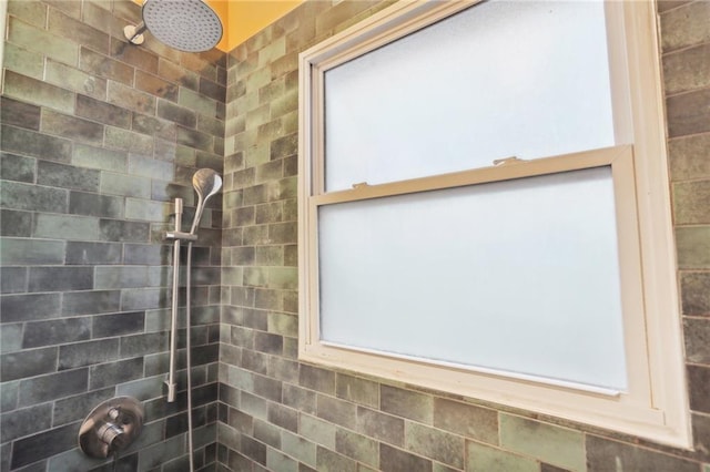 bathroom with tiled shower