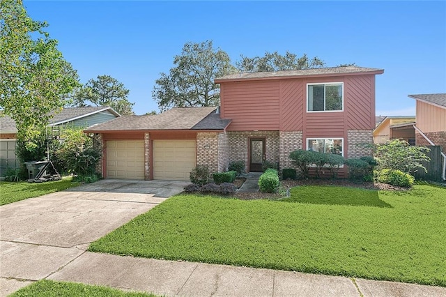 view of front of property with a front lawn and a garage