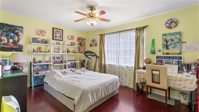 bedroom featuring ceiling fan and dark hardwood / wood-style floors