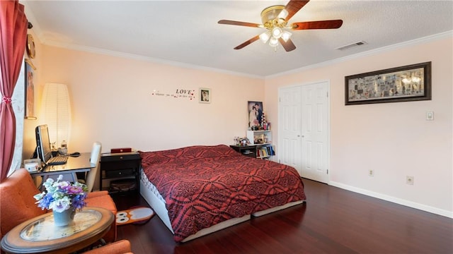 bedroom with ceiling fan, hardwood / wood-style flooring, a closet, and ornamental molding