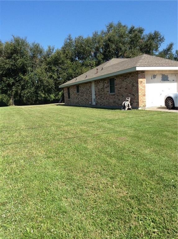 170 Becs Pl, Braithwaite, LA 70040 - view of side of home with a lawn and brick siding