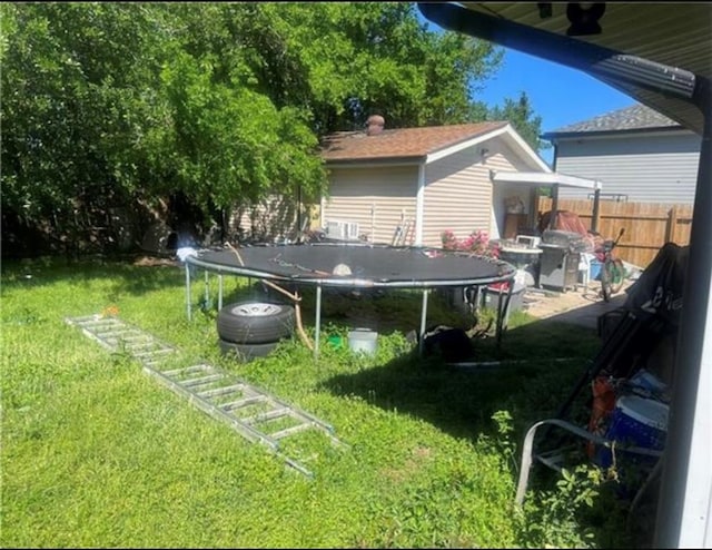 view of yard with a trampoline