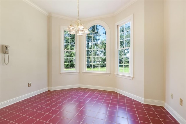 unfurnished dining area with tile patterned flooring, ornamental molding, and an inviting chandelier