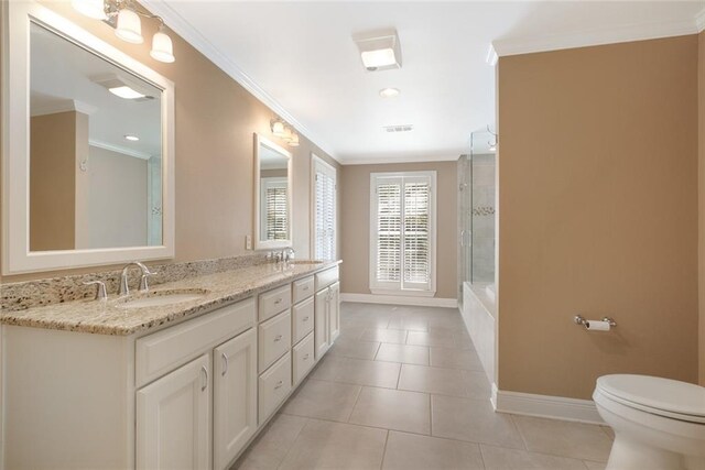 full bathroom with tile patterned flooring, toilet, crown molding, separate shower and tub, and vanity