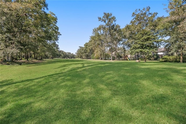 view of home's community with a lawn