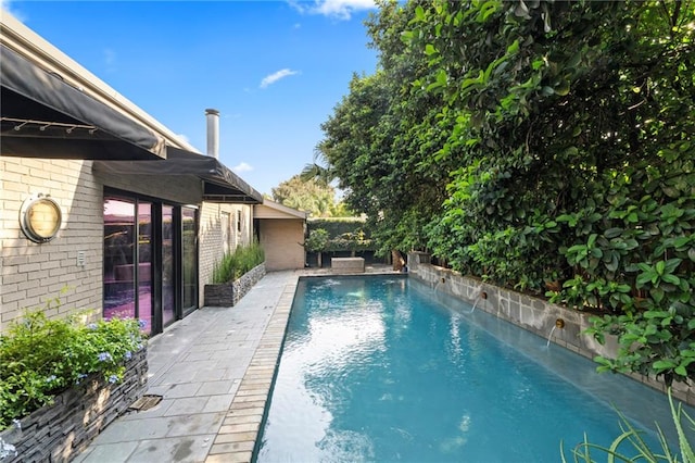 view of pool with pool water feature