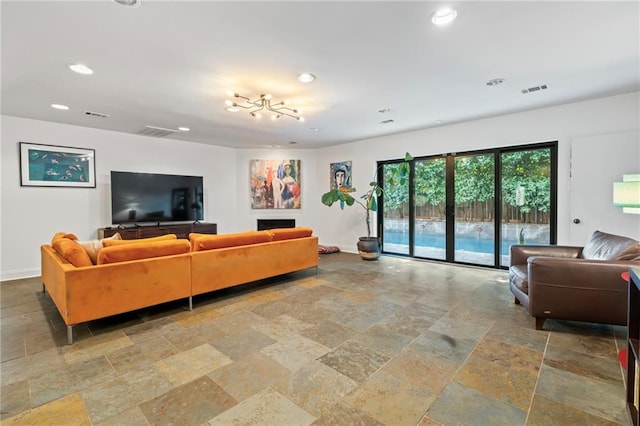 living room with an inviting chandelier