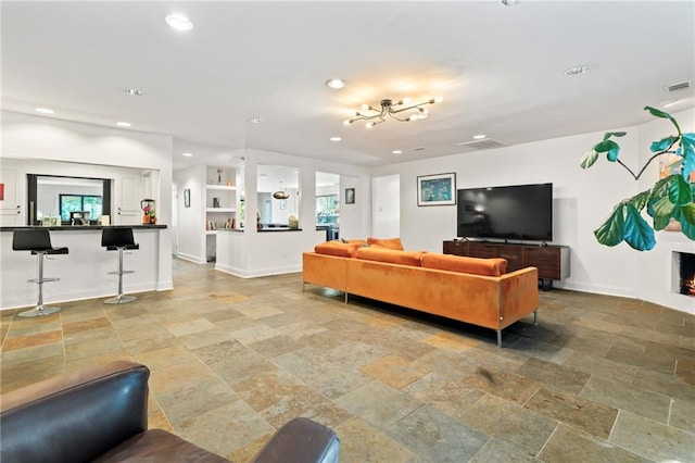 living room featuring a notable chandelier