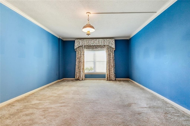 carpeted empty room with a textured ceiling and crown molding