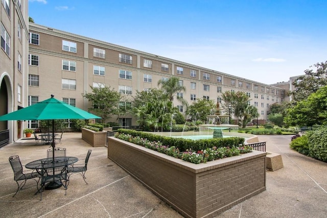 view of property's community with a patio