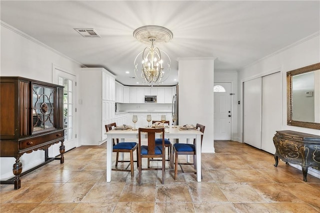 dining room featuring a notable chandelier and crown molding