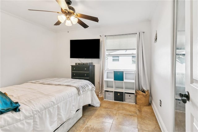 bedroom featuring ceiling fan and crown molding