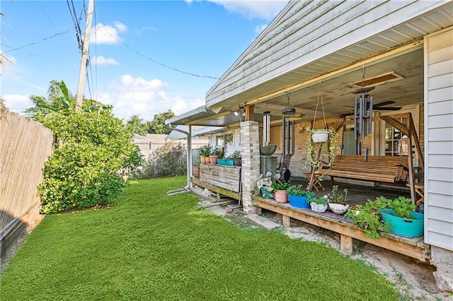 view of yard featuring covered porch