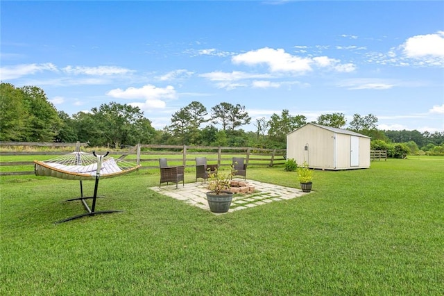 view of yard featuring a patio and a storage shed