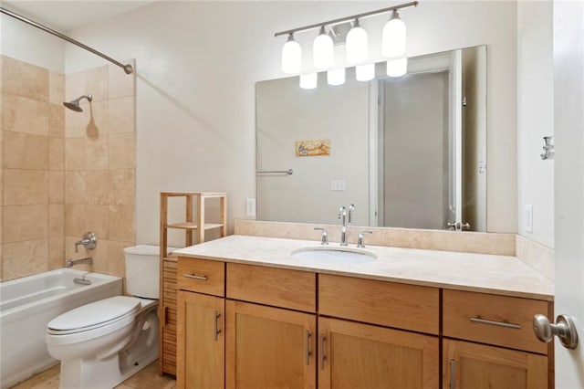 full bathroom with vanity, tiled shower / bath combo, toilet, and tile patterned floors