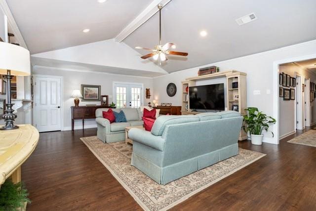 living area featuring dark wood-type flooring, french doors, visible vents, and vaulted ceiling with beams