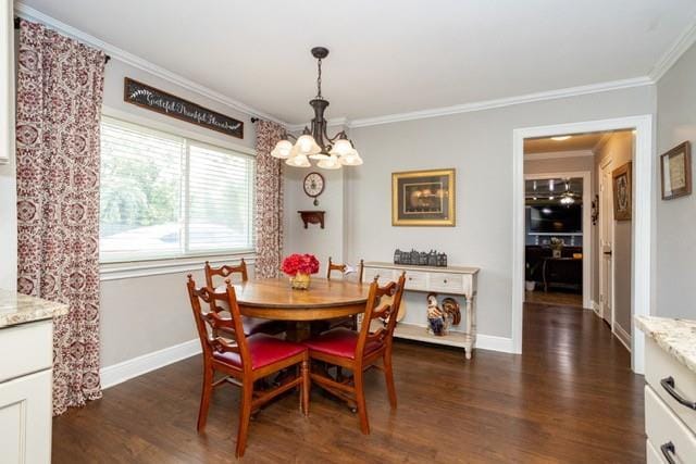 dining area with an inviting chandelier, baseboards, ornamental molding, and dark wood-style flooring