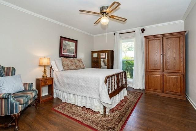 bedroom with dark wood-style floors, ceiling fan, baseboards, and crown molding