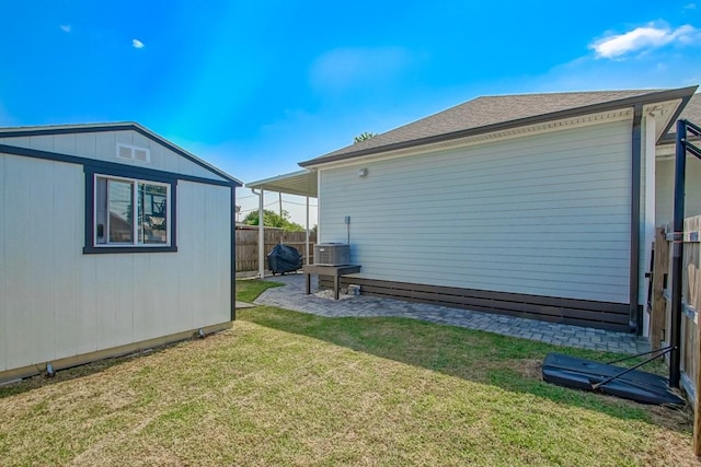 view of home's exterior featuring a yard and an outbuilding