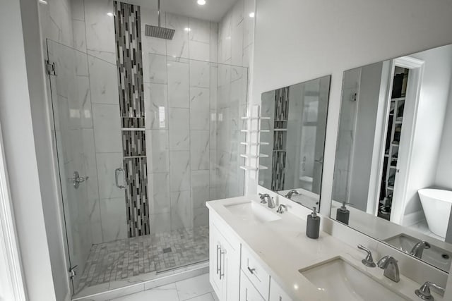 bathroom featuring walk in shower, vanity, and toilet