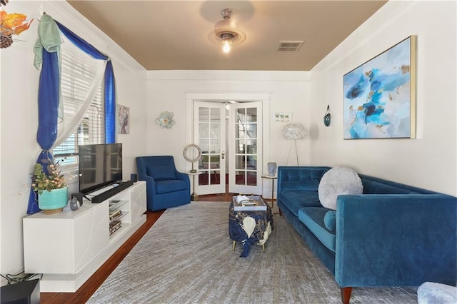 living room featuring french doors and dark hardwood / wood-style flooring