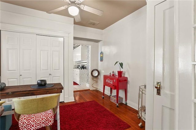 office area featuring ceiling fan and dark hardwood / wood-style flooring