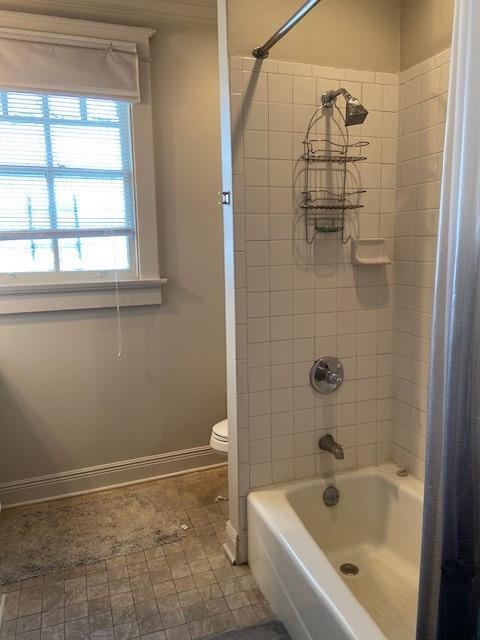 300709 Calhoun St, New Orleans, LA 70118 - full bathroom featuring baseboards, shower / bathtub combination with curtain, and toilet