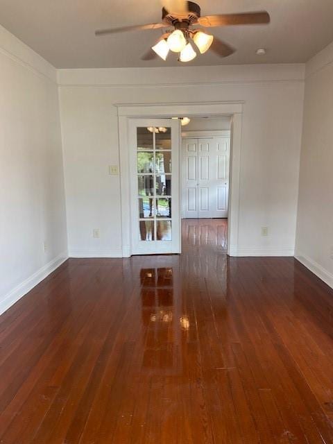 unfurnished room with ceiling fan and dark hardwood / wood-style floors