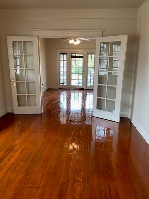 unfurnished room featuring dark wood-type flooring