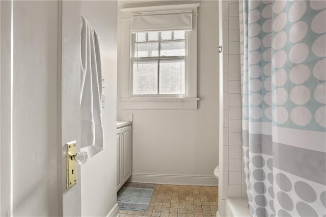 bathroom featuring vanity, toilet, and a shower with shower curtain