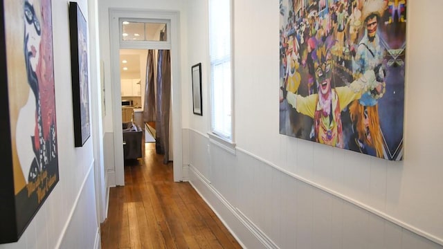 hallway with dark hardwood / wood-style flooring