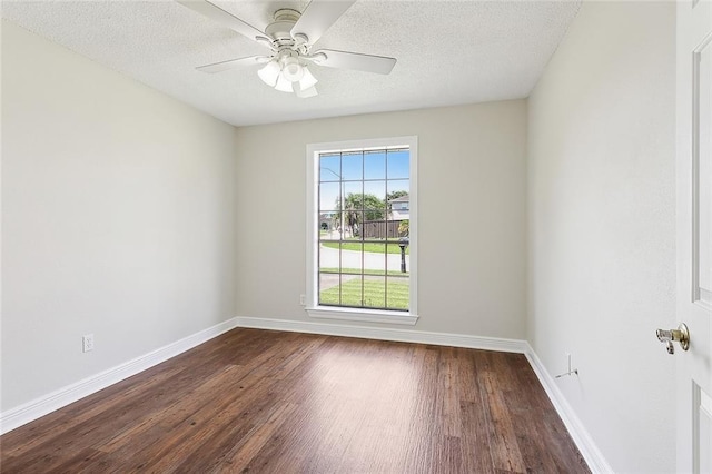 unfurnished room with dark wood-type flooring, ceiling fan, and a textured ceiling