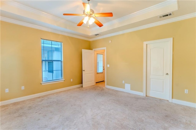 40145 Taylors Trl Unit 204, Slidell, LA 70461 - unfurnished bedroom with carpet, ornamental molding, a tray ceiling, and ceiling fan
