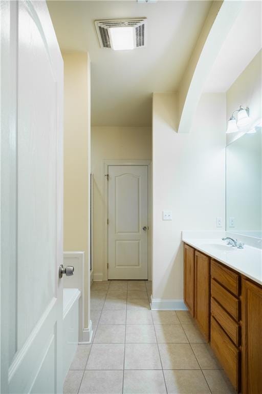 bathroom with tile patterned floors and vanity