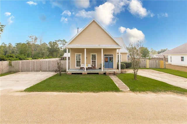 view of front of home featuring a front yard and covered porch