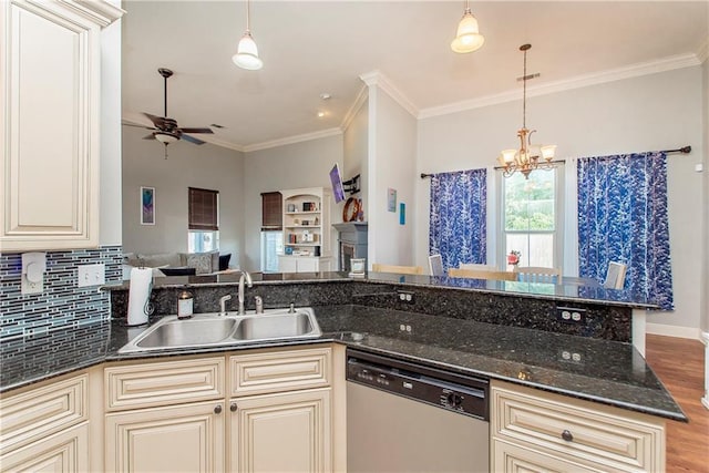 kitchen with pendant lighting, dishwasher, and sink