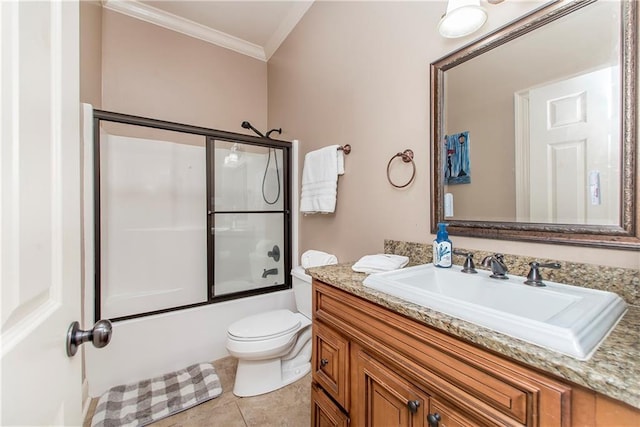 full bathroom featuring bath / shower combo with glass door, ornamental molding, vanity, toilet, and tile patterned floors