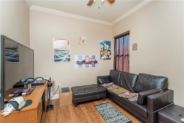 living room with crown molding, ceiling fan, and light wood-type flooring