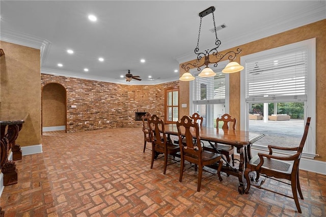 65520 S Hickory Dr, Pearl River, LA 70452 - dining space with arched walkways, brick floors, ceiling fan, recessed lighting, and ornamental molding