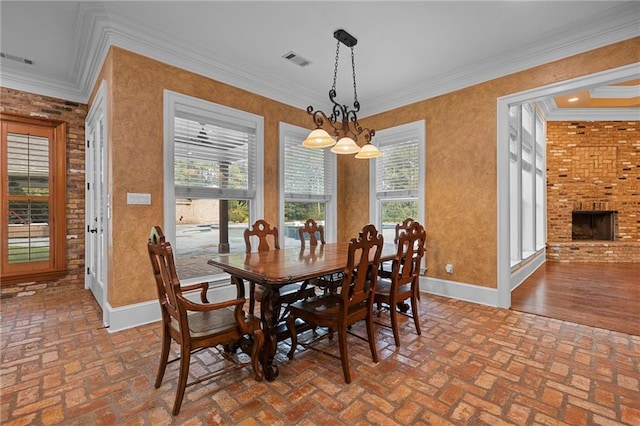 65520 S Hickory Dr, Pearl River, LA 70452 - dining room with brick floors, baseboards, ornamental molding, and a fireplace