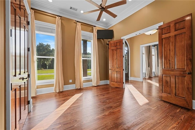 entryway with ornamental molding, wood-type flooring, and ceiling fan