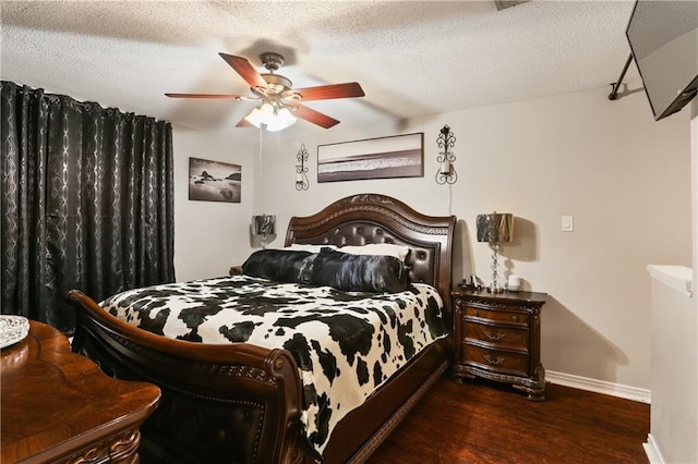 bedroom featuring dark hardwood / wood-style floors, a textured ceiling, and ceiling fan