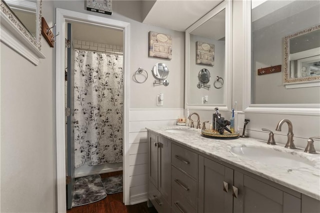 bathroom with vanity, hardwood / wood-style floors, and walk in shower