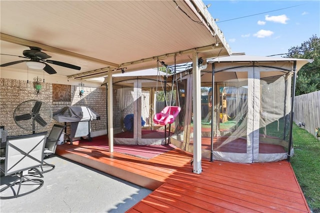 wooden terrace featuring ceiling fan